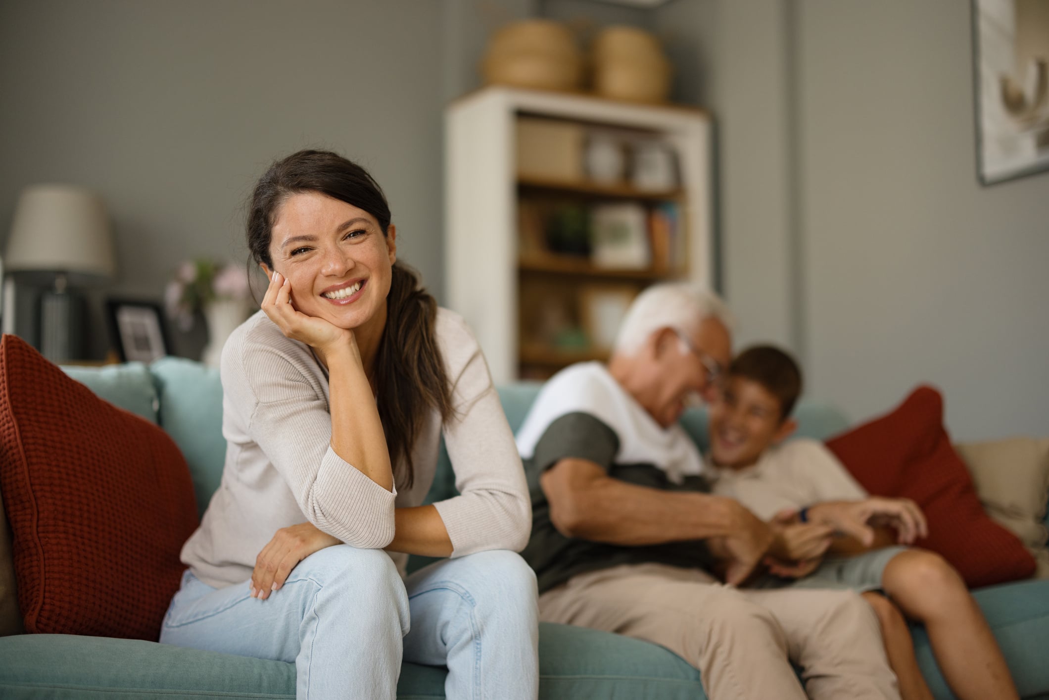 Woman smiling because she has reviewed and updated her KiwiSaver account.